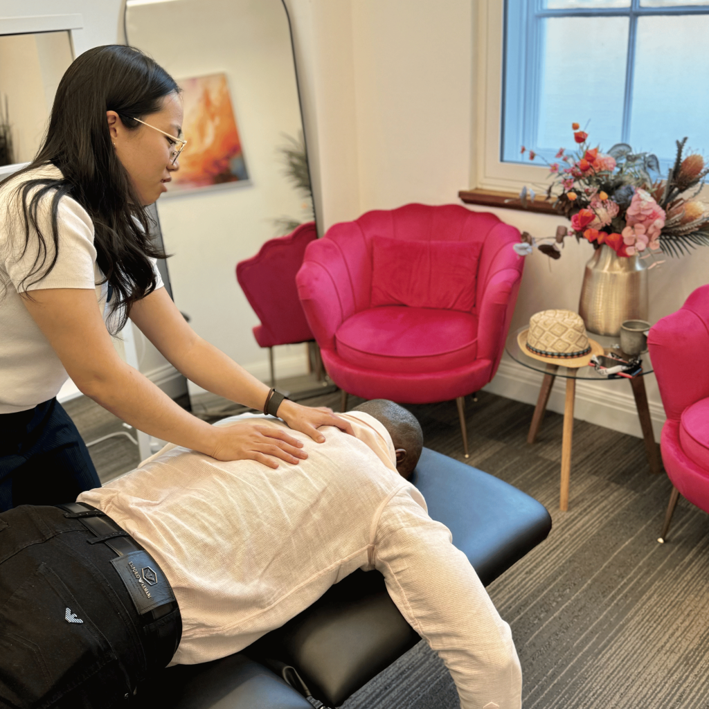 Chiropractor treating a patient’s leg for disc-related pain at Mayfair & Belgravia Chiropractic