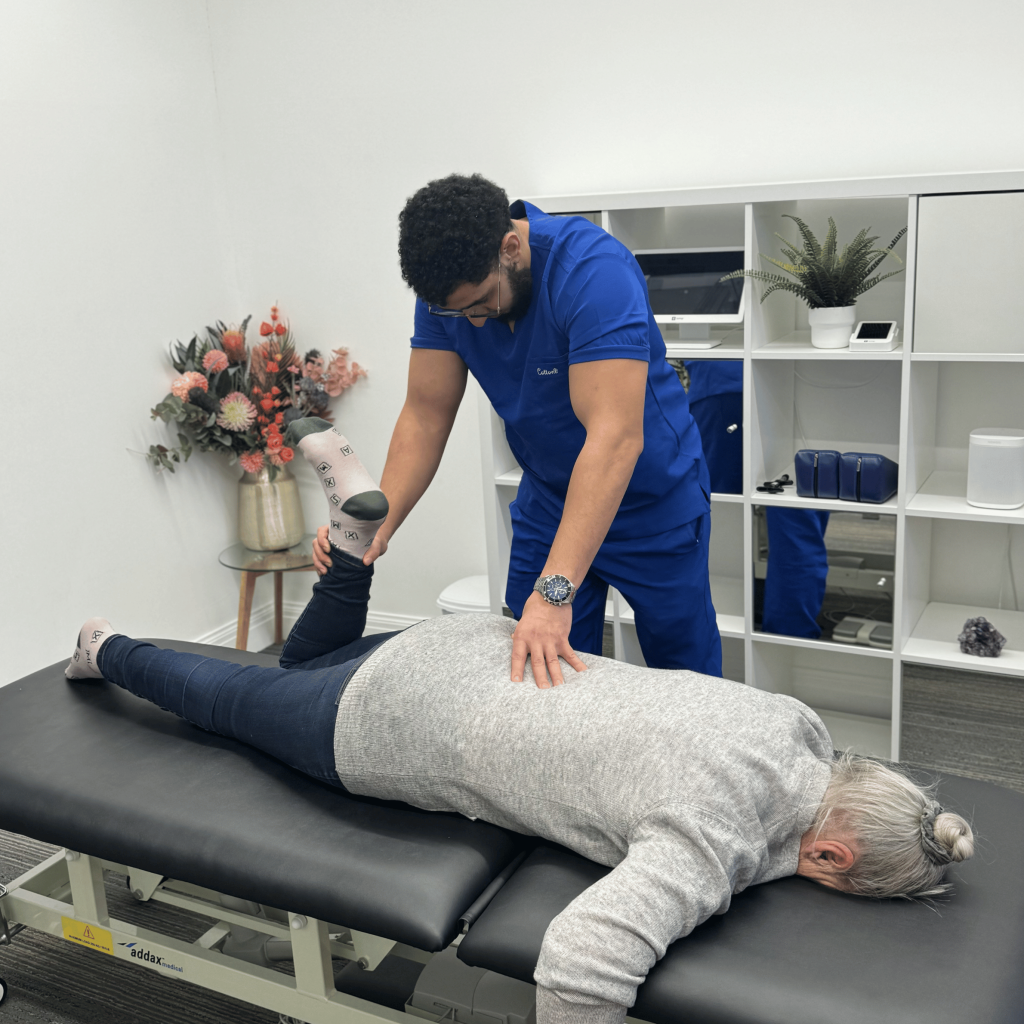 Chiropractor treating a patient’s lower leg for sciatica at Mayfair & Belgravia Chiropractic