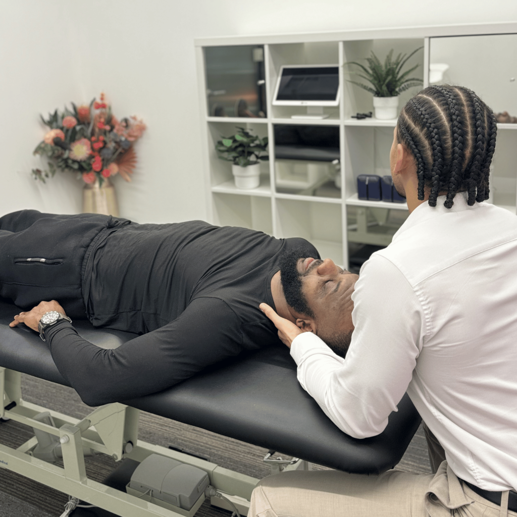 Chiropractor performing cranial therapy at Mayfair & Belgravia Chiropractic