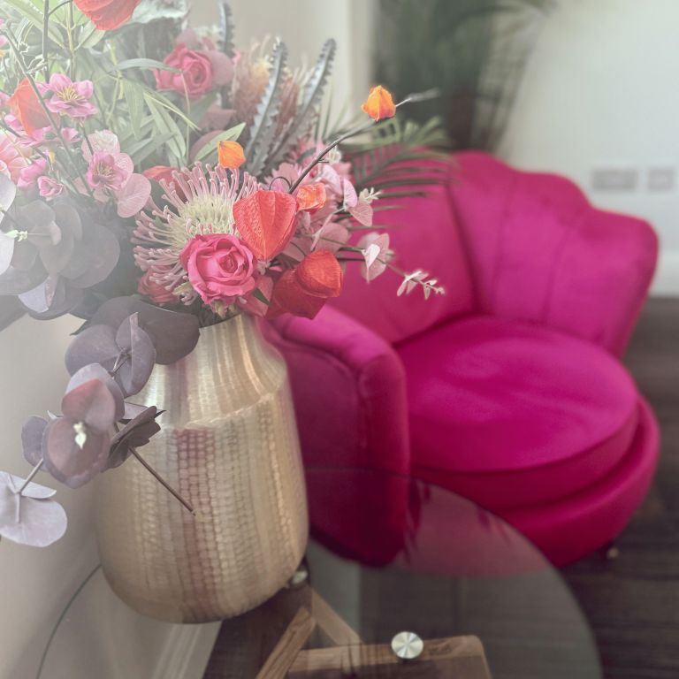 Reception seating and flowers at Mayfair & Belgravia Chiropractic clinic